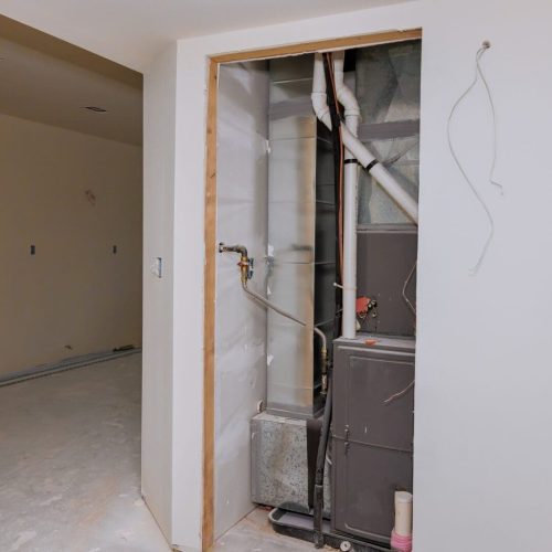 New home construction with installation of heating system in basement of house under remodeling